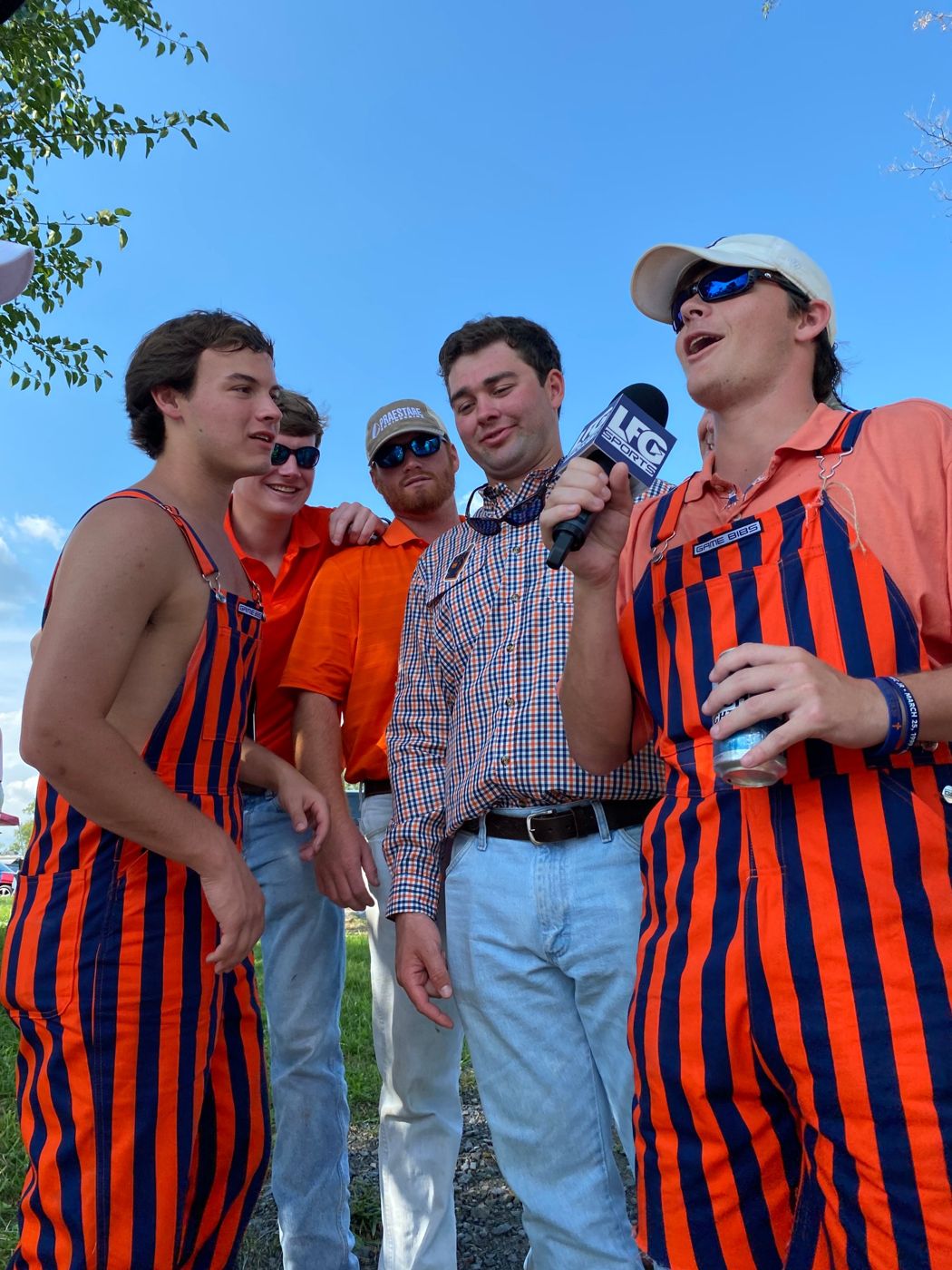 auburn fans in striped overalls on the lfg mic