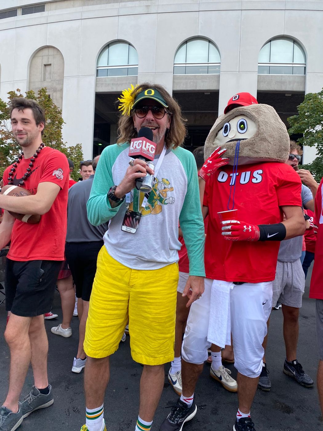 an oregon superfan and brutus on the lfg mic